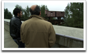 Rexhep Hoxha and his son Ermal at Yad Vashem viewing a train car used to transport Jews to concentration camps. ©JWM Productions, LLC